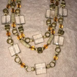 Beautiful beige and orange beaded triple necklace
